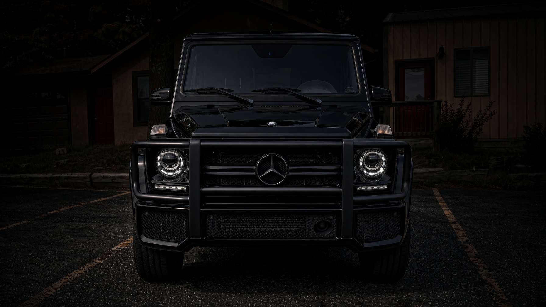 Black Mercedes G-Wagon parked at dusk, front view